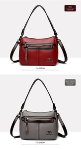 Close-up of red and deep grey pebbled leather handbags with adjustable straps