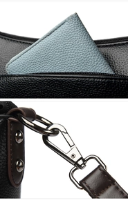 Detail of lychee pattern leather texture with metal hook and blue inner compartment