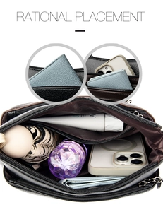Detail of the multi-compartment interior and leather texture of the contrast handbag