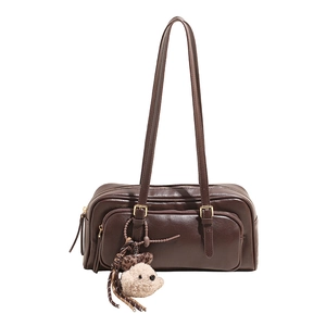 Deep brown leather rectangular shoulder bag with dual straps and cute plush charm