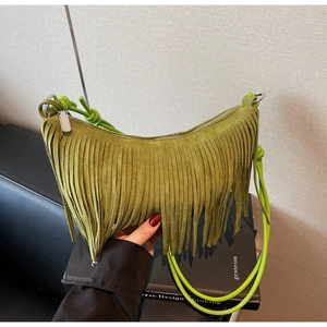 Chic avocado green suede crescent bag with bohemian fringe and silver ring zipper detail