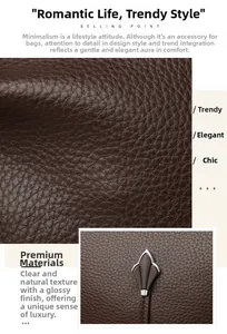 Detail of dark brown leather texture with silver leaf-shaped metal decorative buckle