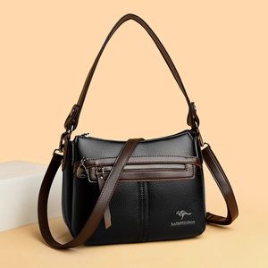 Black pebbled leather crossbody bag for women with contrast brown trim and dual straps