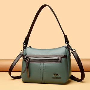 Minimalist green lychee grain leather crossbody bag with brown straps and metal logo
