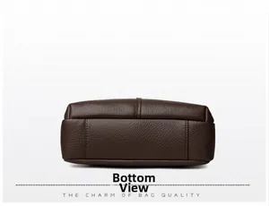 Detail of reinforced stitching on deep brown litchi pattern leather bag bottom