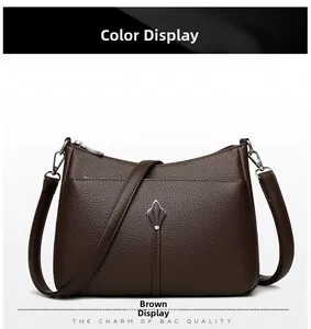 Detailed close-up of dark brown lychee pattern leather texture and silver metal hardware