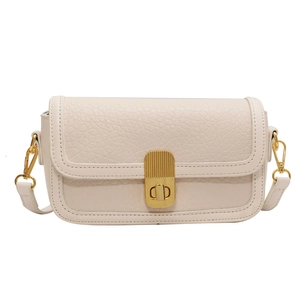 Minimalist beige textured leather square handbag with a stylish gold metal twist lock