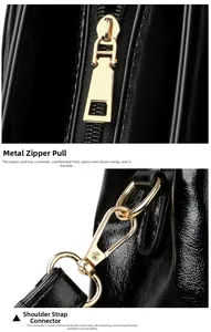 Detail of high-gloss black shoulder bag featuring gold-plated zipper and metal strap buckles