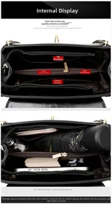 Detail view of the black leather handbag's multi-compartment interior with zip pockets