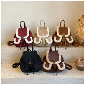 Detail shot of mini vintage backpacks in five colors with faux shearling trim accents