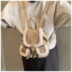 Detail of mini faux suede backpack with plush fleece trim and adjustable straps
