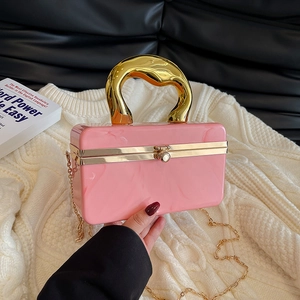 Pink marble acrylic evening clutch with gold U-shaped handle and detachable chain strap