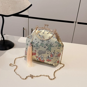 Vintage evening clutch with traditional figure art, golden handle, and pink tassel