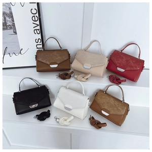 Detailed collection of minimalist leather handbags in six classic colors on white stands