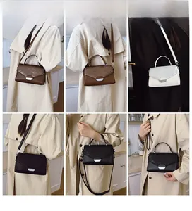 Detail shots of modern versatile crossbody bag in vintage brown, white and black colors
