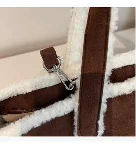 Macro view of suede tote with faux shearling trim and silver metal swivel hook detail