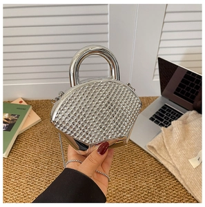 Sparkling silver fan-shaped clutch bag with rhinestones, metal handle and chain strap