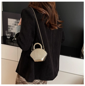 Chic gold acrylic evening bag with white pearl embellishments and metal chain strap