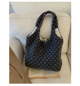 Close-up of grey plush tote bag with white spots and soft fleece fabric texture