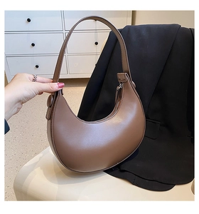 Detailed view of deep brown hobo crescent bag with smooth leather finish and metal zipper