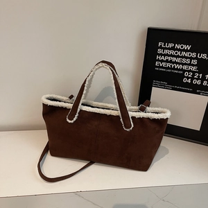 Brown faux suede tote bag with white faux fur trim and adjustable crossbody strap