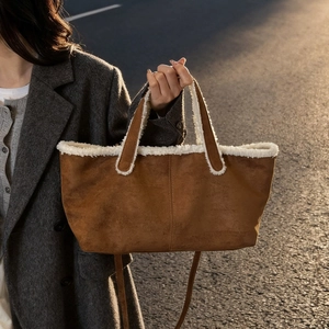 Brown suede tote bag with white fleece trim and crossbody strap for autumn/winter casual wear