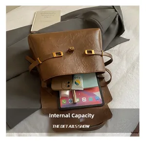 Interior view of brown tote bag showing large capacity for tablet and daily items