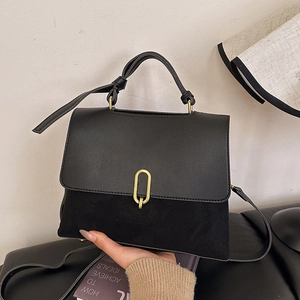 Retro black patchwork crossbody bag with gold oval clasp and adjustable strap