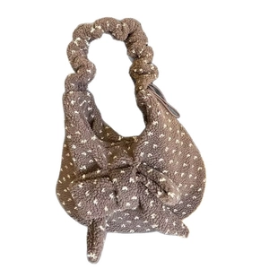 Brown teddy fleece tote bag with white polka dots and a large bow decoration