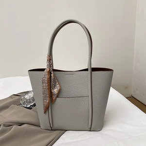 Chic grey litchi grain leather tote bag with silk scarf and front pocket detail
