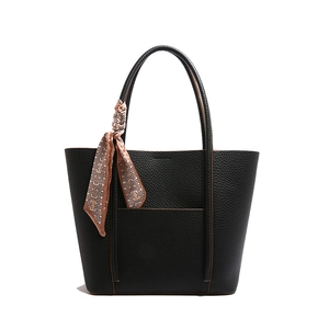 Classic black lychee pattern leather tote bag with geometric printed decorative scarf