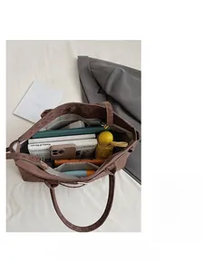 Detail view of large leopard print tote bag with spacious interior compartments for daily items