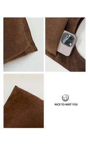 Detail view of brown faux suede shoulder bag with side stitching and smartphone pocket