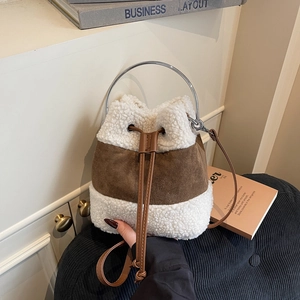 Plush contrast-stitched drawstring bucket bag with sheepskin wool and metal ring handle