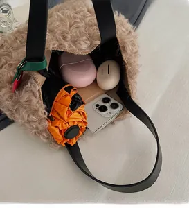 Top view of plush bucket bag showing spacious interior with leather handles