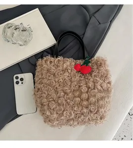 Close-up of plush tote bag with lamb wool texture, cherry charm, and size reference