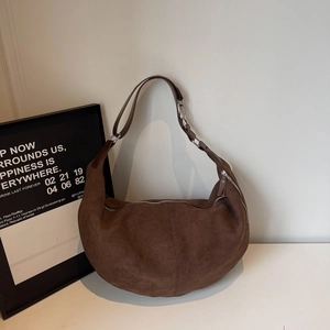Coffee brown suede hobo bag with moon shape and silver metal hardware details
