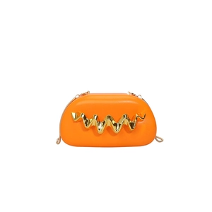Fashionable orange semi-circular crossbody bag with wave gold metal decoration and chain