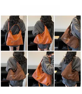 Detailed views of woven leather hobo bags in brown and tan with decorative metal zippers