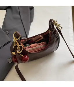 Interior view of brown vintage crescent bag showing space for phone and wallet