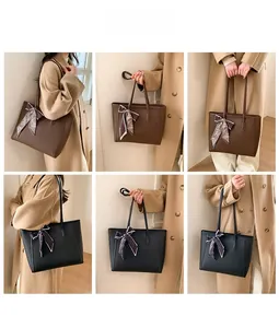 Detail of large tote bag with printed silk scarf showing black and brown color options