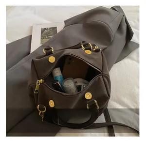 Interior view showing the large capacity of this vintage dark brown boston bag