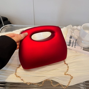 Translucent red acrylic晚宴 handbag with frosted finish and gold metal chain strap