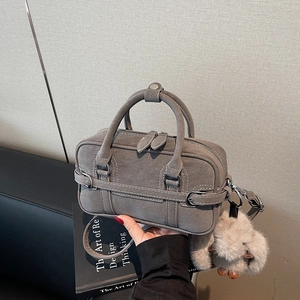 Grey vintage Boston style shoulder bag with plush rabbit charm and adjustable strap
