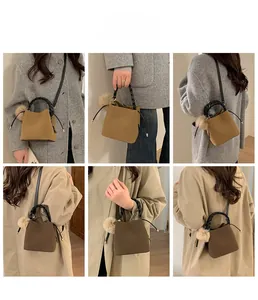 Chic brown bucket bag with plush charm and woven handle shown on model in various angles
