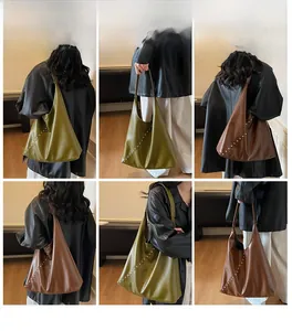 Detail view of large tote bags with rivets in olive green and dark brown faux leather
