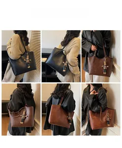 Detail shots of large tote bag in black and brown with plaid rabbit doll charm