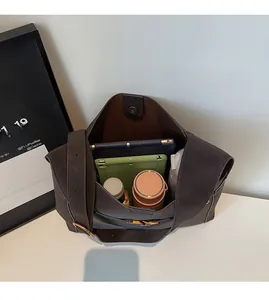 Spacious interior of dark brown faux suede tote bag showing large capacity for essentials
