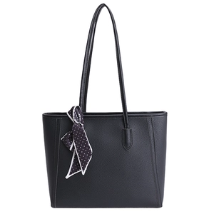 Minimalist black leather tote bag with polka dot scarf detail and spacious interior