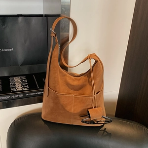 Retro brown leather hobo shoulder bag with minimalist curved design for women's casual style